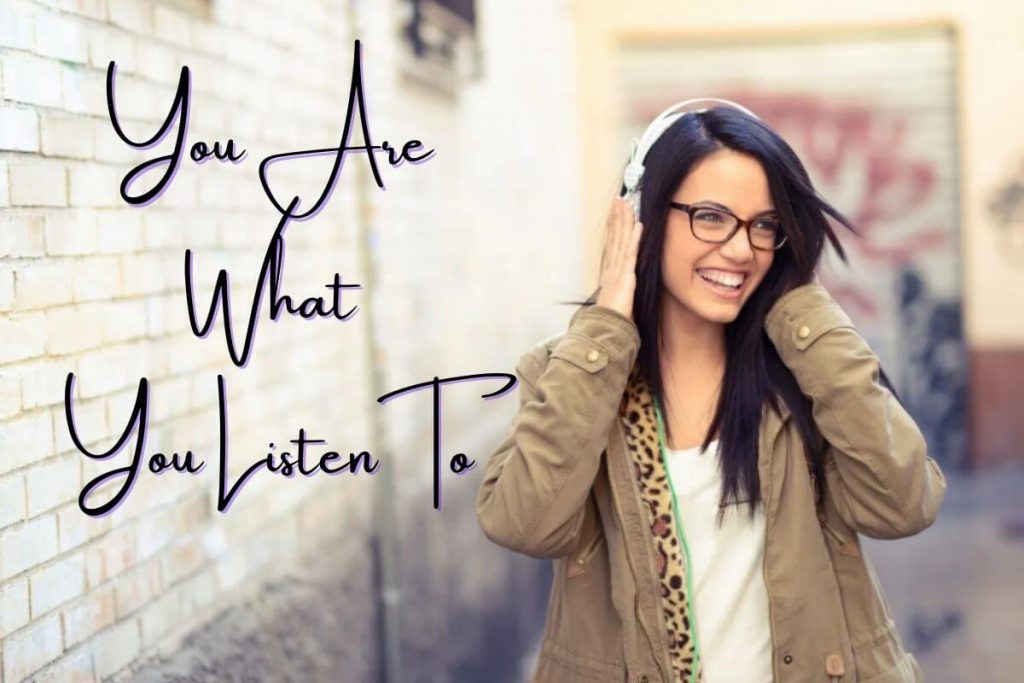 woman listening to empowering songs on her headset