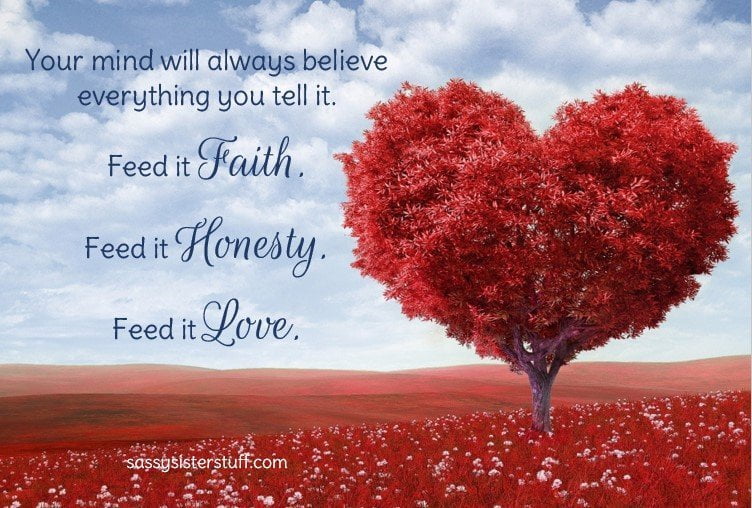 red heart shaped tree in a field of red flowers against blue sky and a quote about love