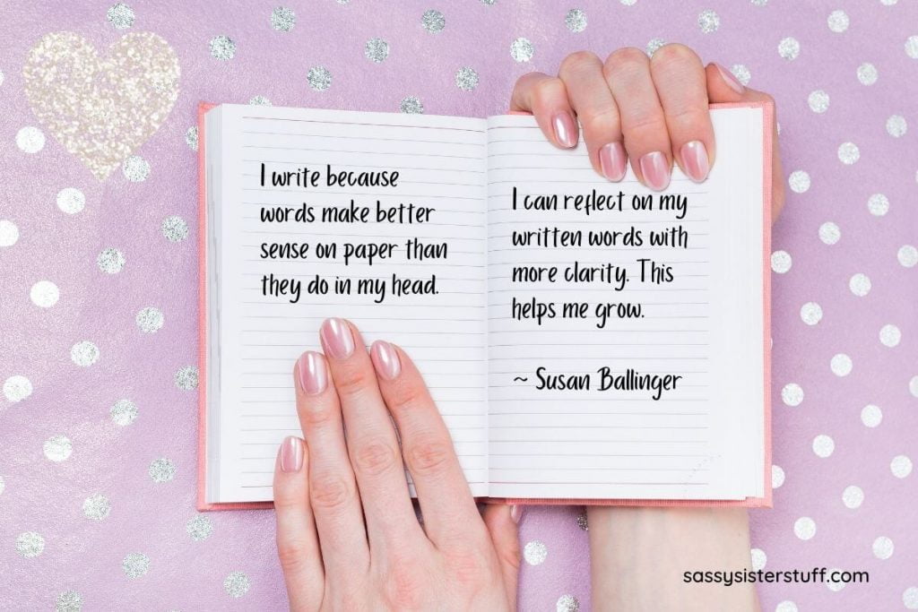pink background with silver dots and a woman's hands holding an open journal with a quote about journaling
