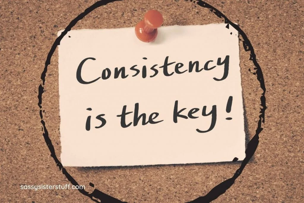 consistency is the key written on a note and thumb tacked to a cork board