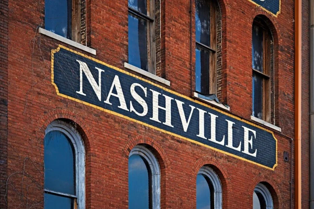 nashville sign on the side of a brick building