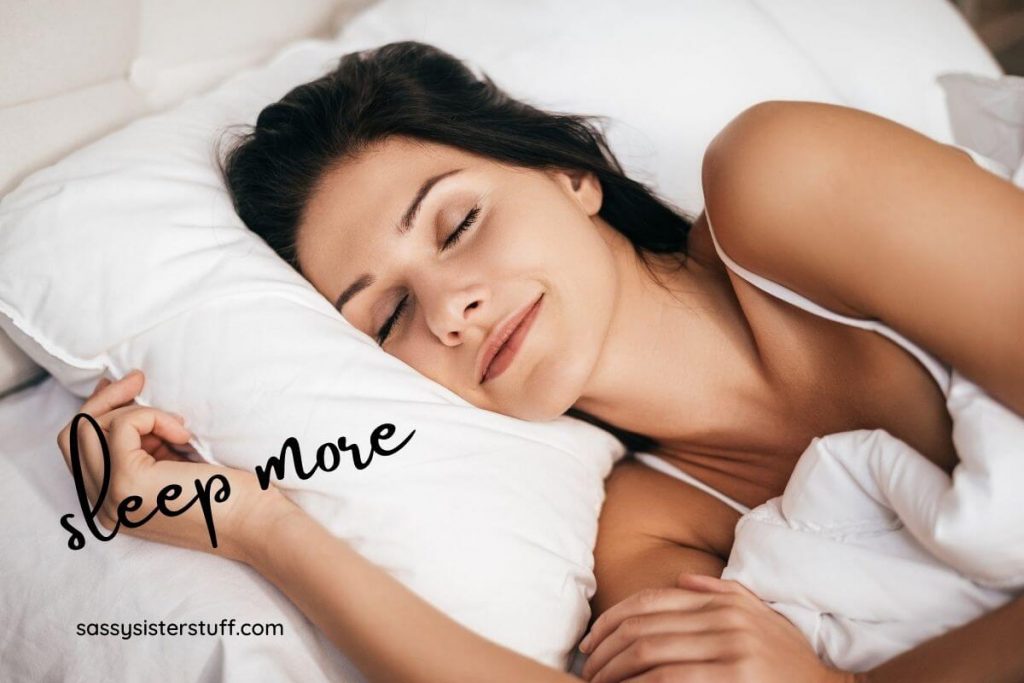 a woman sleep peacefully as one of her acts of self care