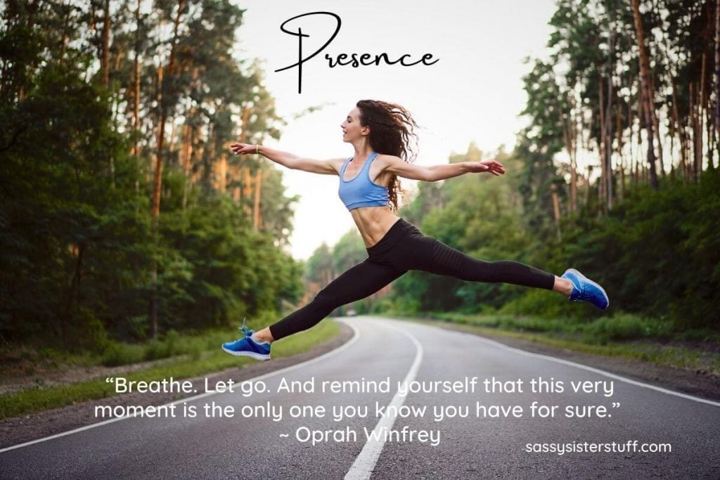 young woman in exercise clothing leaps high across a street and a quote reminds you about staying present in the moment