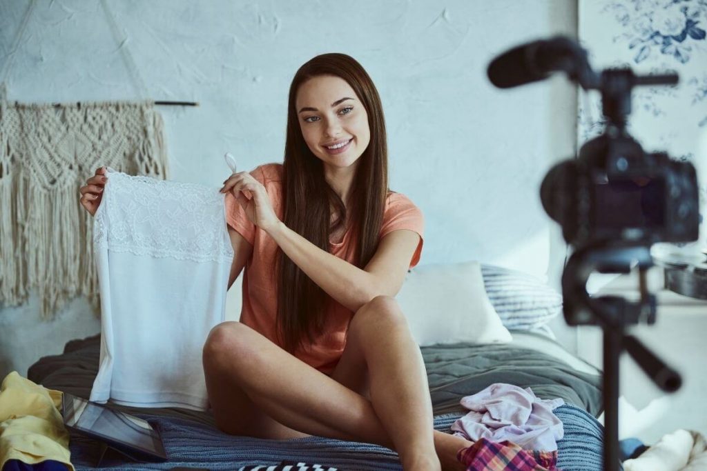 young happy woman taking selfies for her fashion blog