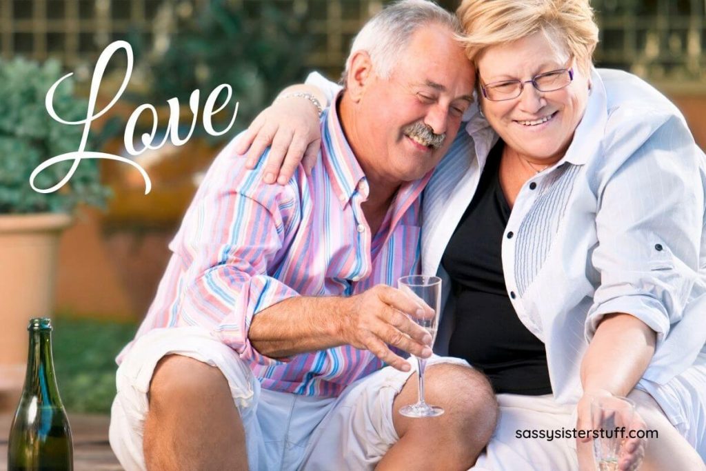 a loving middle aged couple embrace and smile
