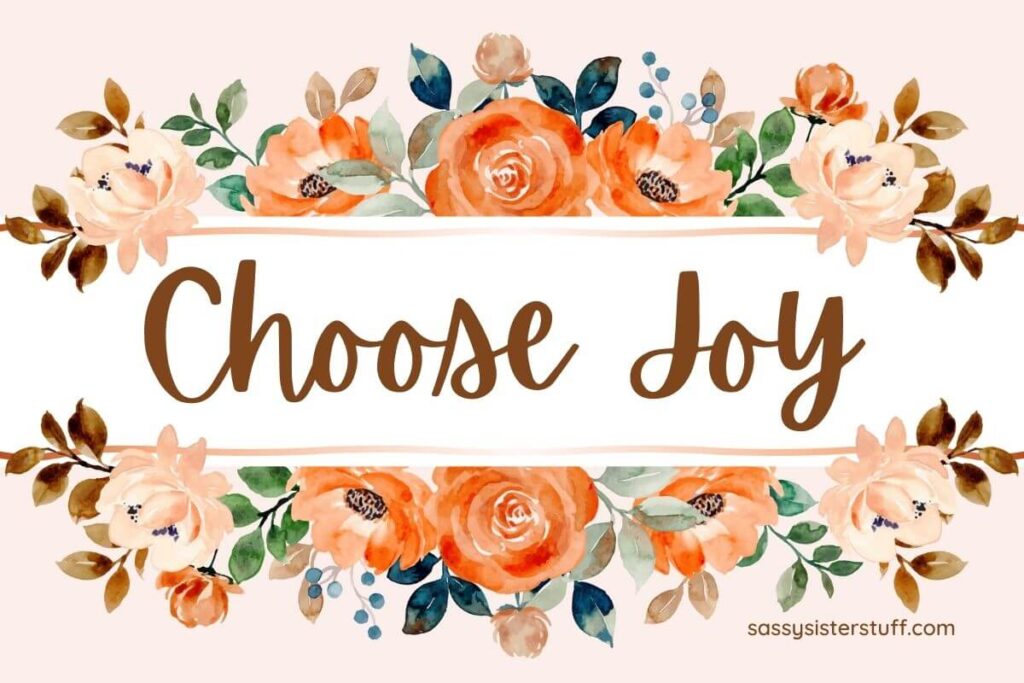 floral design with orange coral and peach flowers and the words choose joy in the center