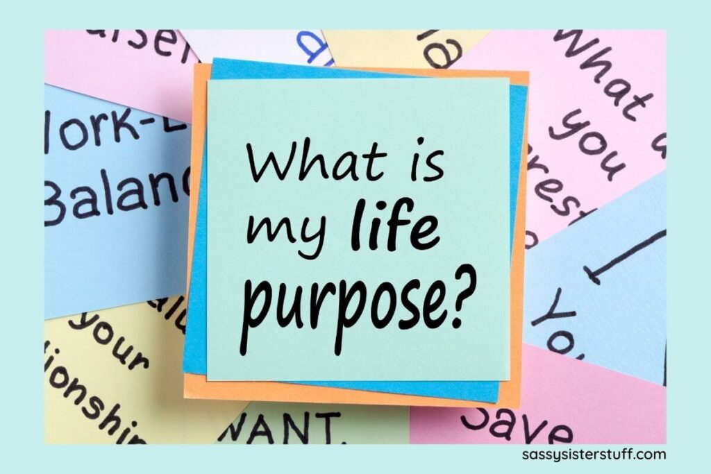 post it notes scattered around with words associated with passion and purpose and a question that says what is my life purpose