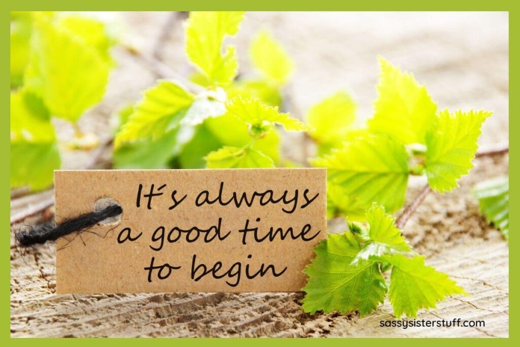 green leaves laying on sandy ground and a tag that says it's always a good time to begin