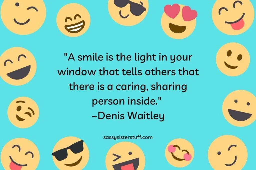 a teal background with 14 different happy faces around the edges and a smile quote in the center