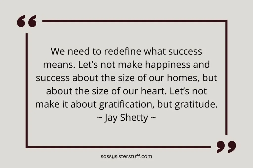 a Jay Shetty quote about success and happiness on a grayish tan background