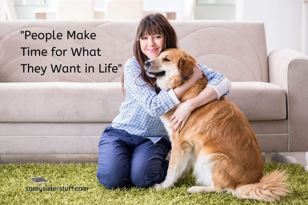 People make time for what they want in life title image of a happy woman sitting on the floor hugging her big fluffy brown happy dog in front of her sofa