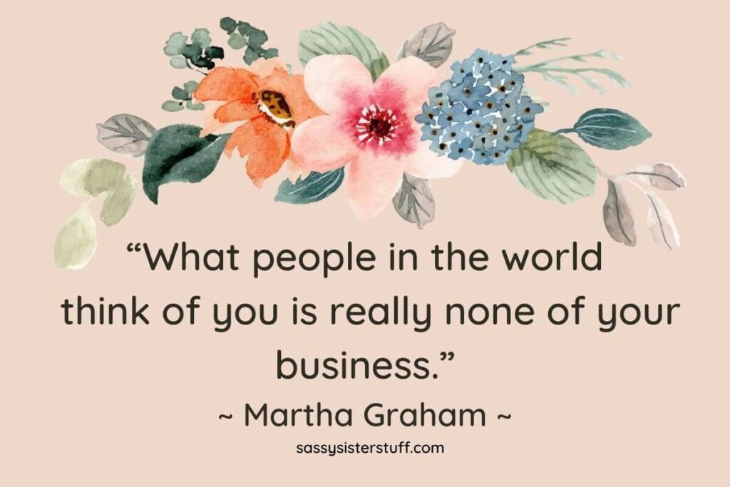 pale beige background with a floral swag in blue pink and orange with leaves in shades of green and a quote at the bottom by martha graham