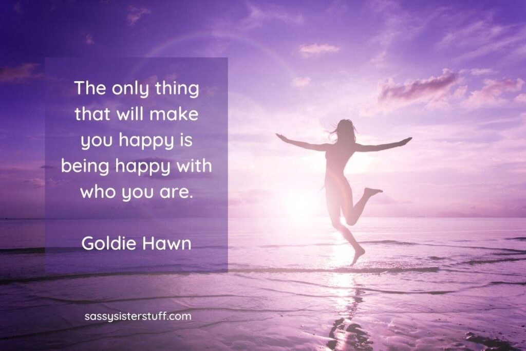 a silhouette of a woman jumping in the air along a shoreline and a quote from goldie hawn about choosing happiness