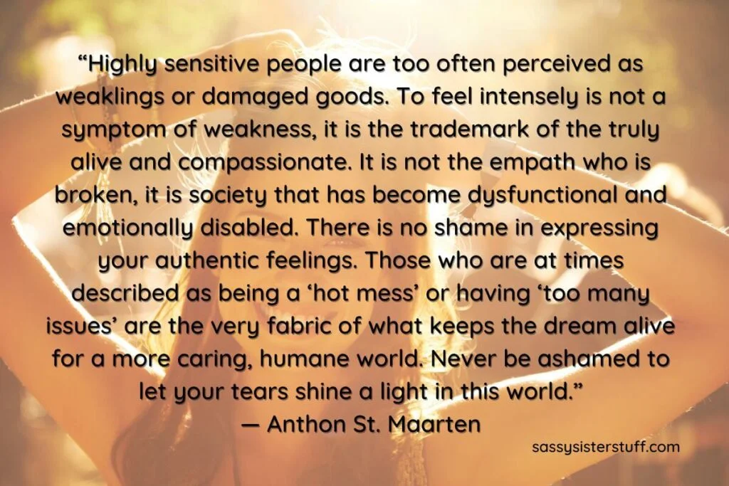 an inspirational quote about highly sensitive people overlays a photo of a young woman standing in the sunlight smiling and putting her hair up in a ponytail