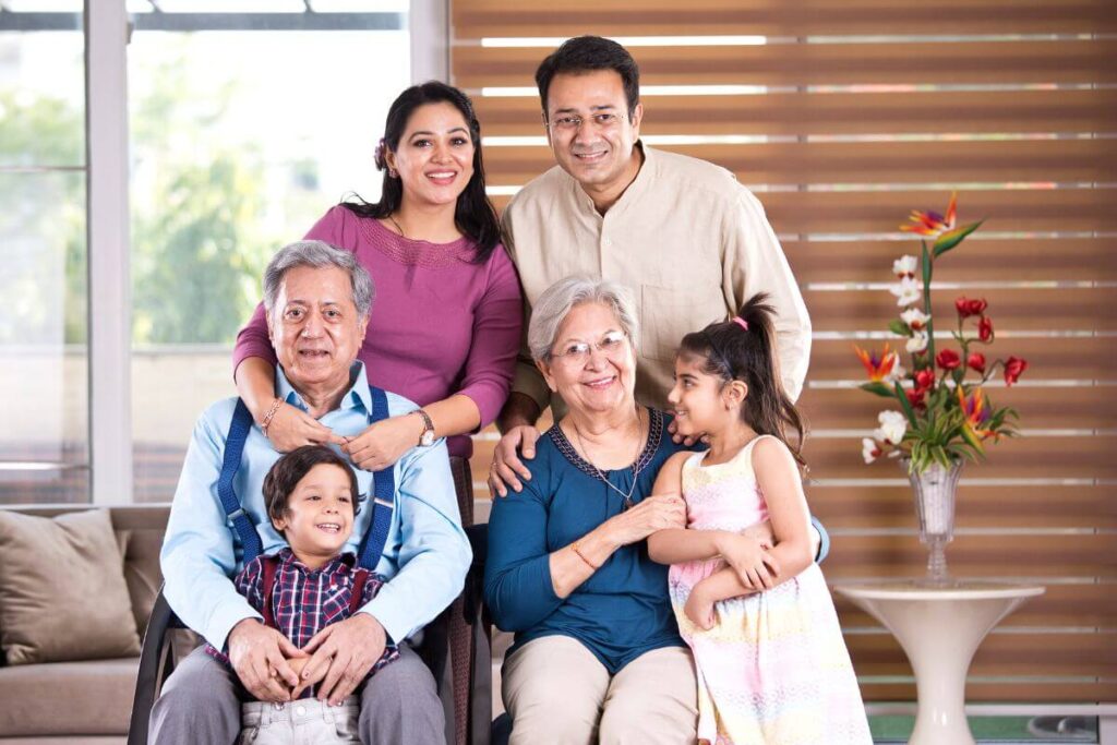 mom dad grandma grandpa and two children happiness pose for a family photo