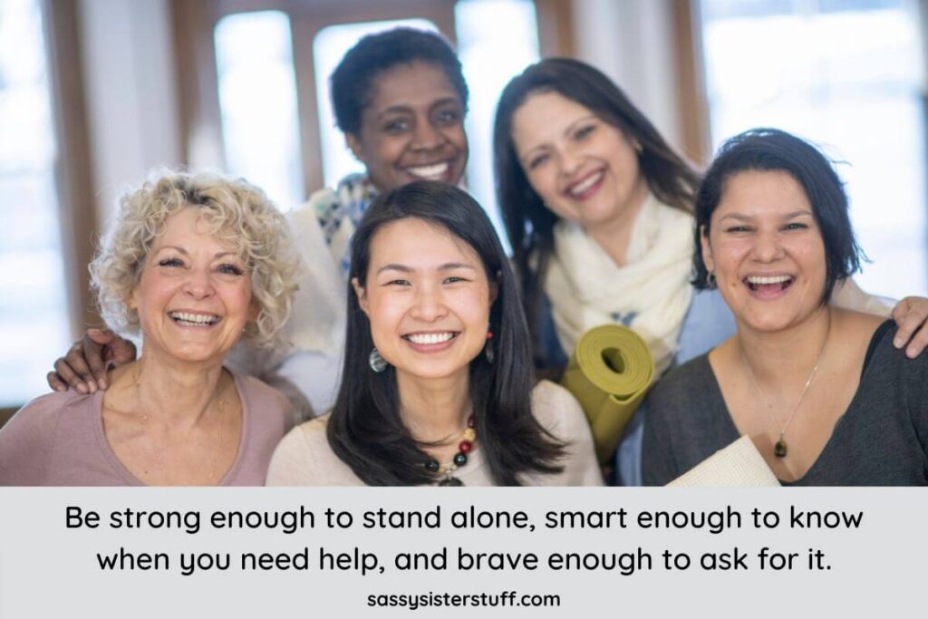 five happy proud and hard working women gather together in the office for a photo