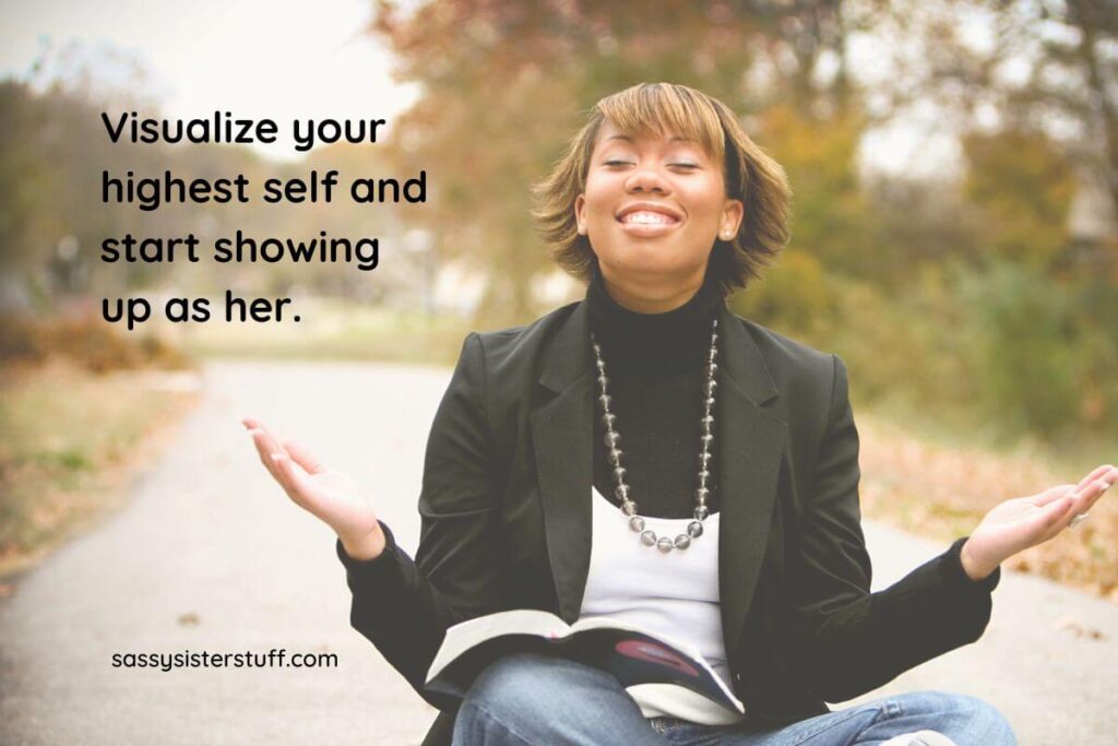 a young lady with a big smile on her face as she visualizes her highest self