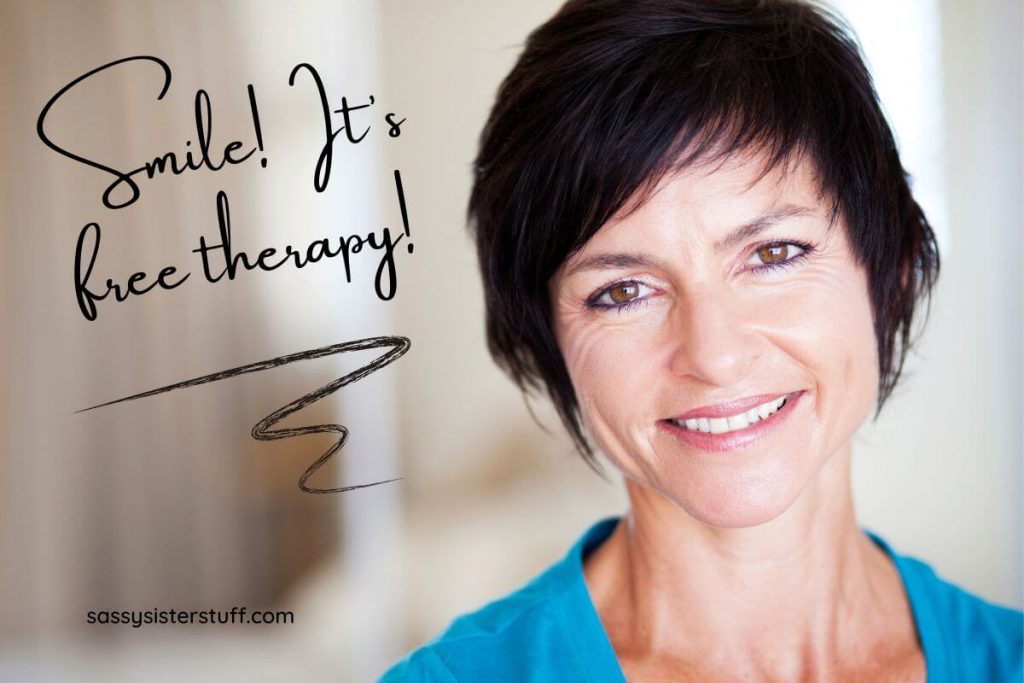 a middle aged women smiles because it's free therapy