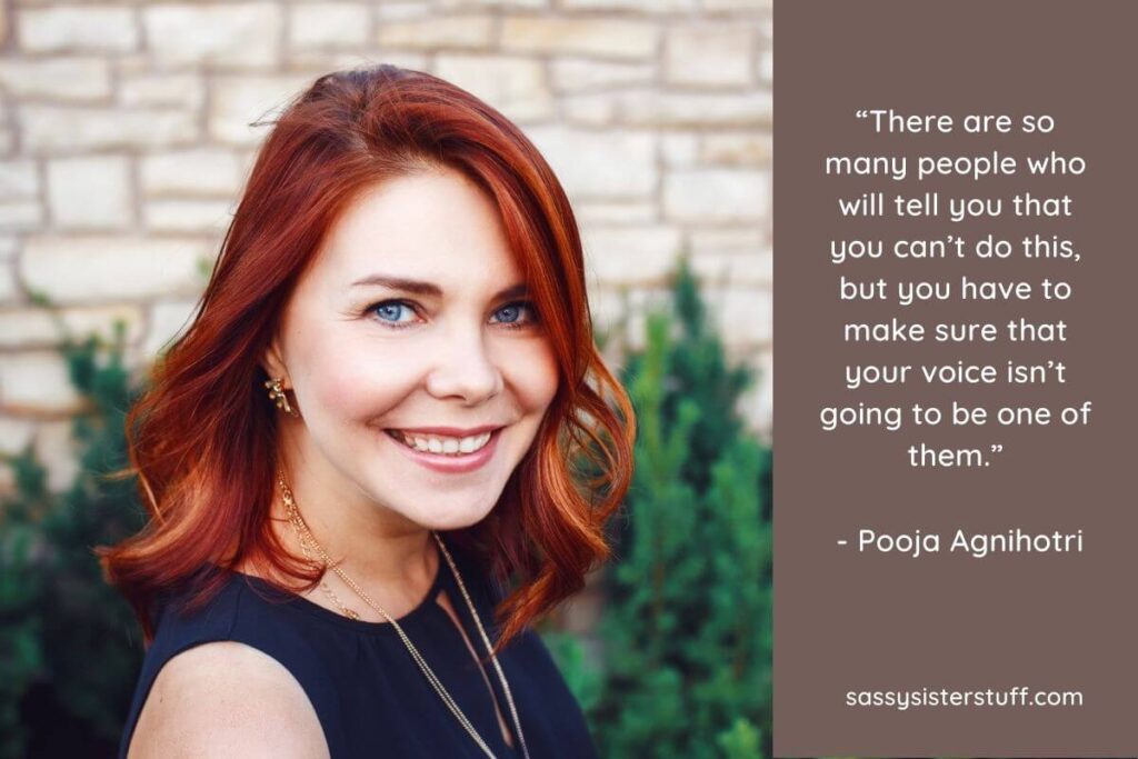 a beautiful red haired happy woman smiles at the camera confidently after she has read her affirmations for negative thoughts
