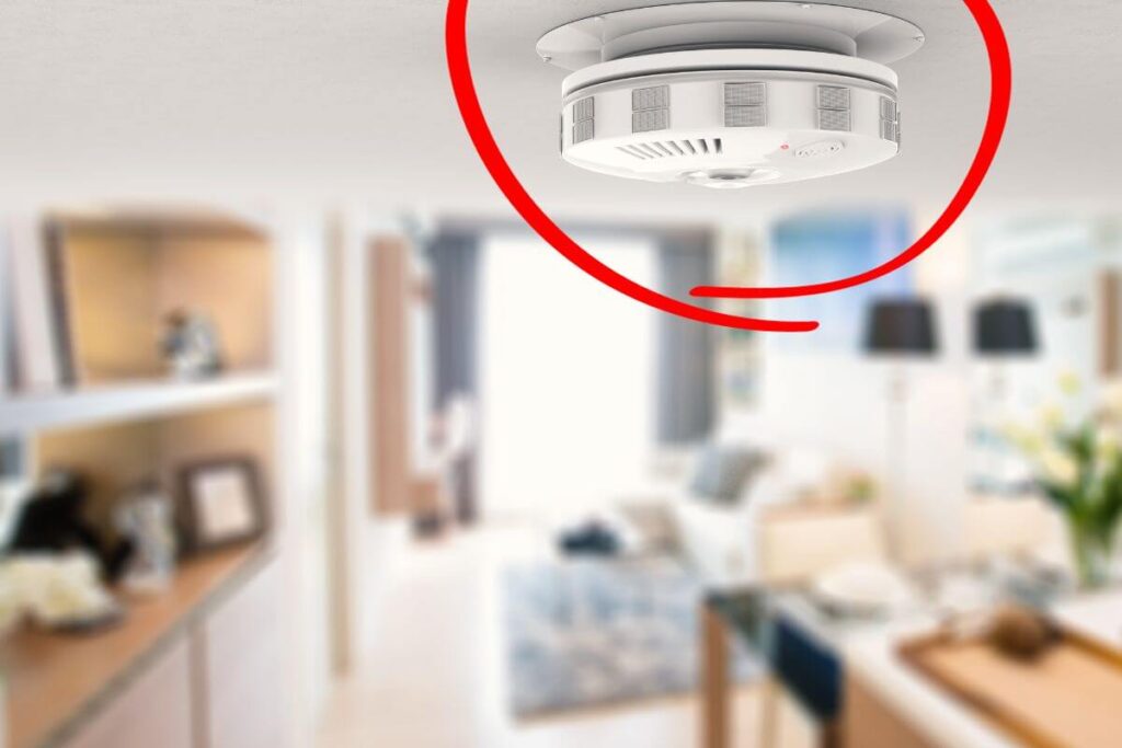 an updated smoke detector on the ceiling of a small kitchen area
