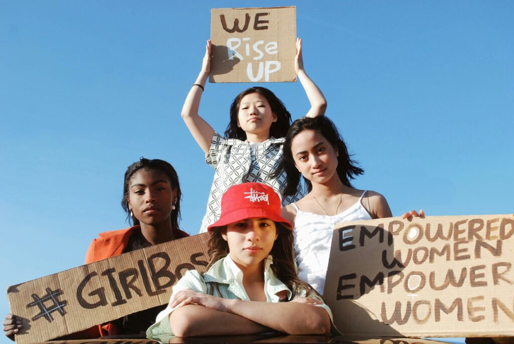 3_women_holding_brown_cardboard_box.Natalie_Hua