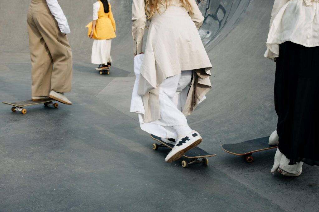 A_group_of_individuals_skateboarding_in_a_skate_park_wearing_fashionable,_flowy_attire..cottonbro_studio