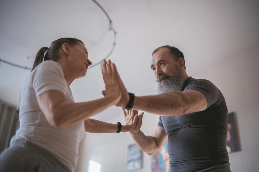Elderly_couple_practicing_yoga_indoors,_focusing_on_health_and_mindfulness..Mikhail_Nilov