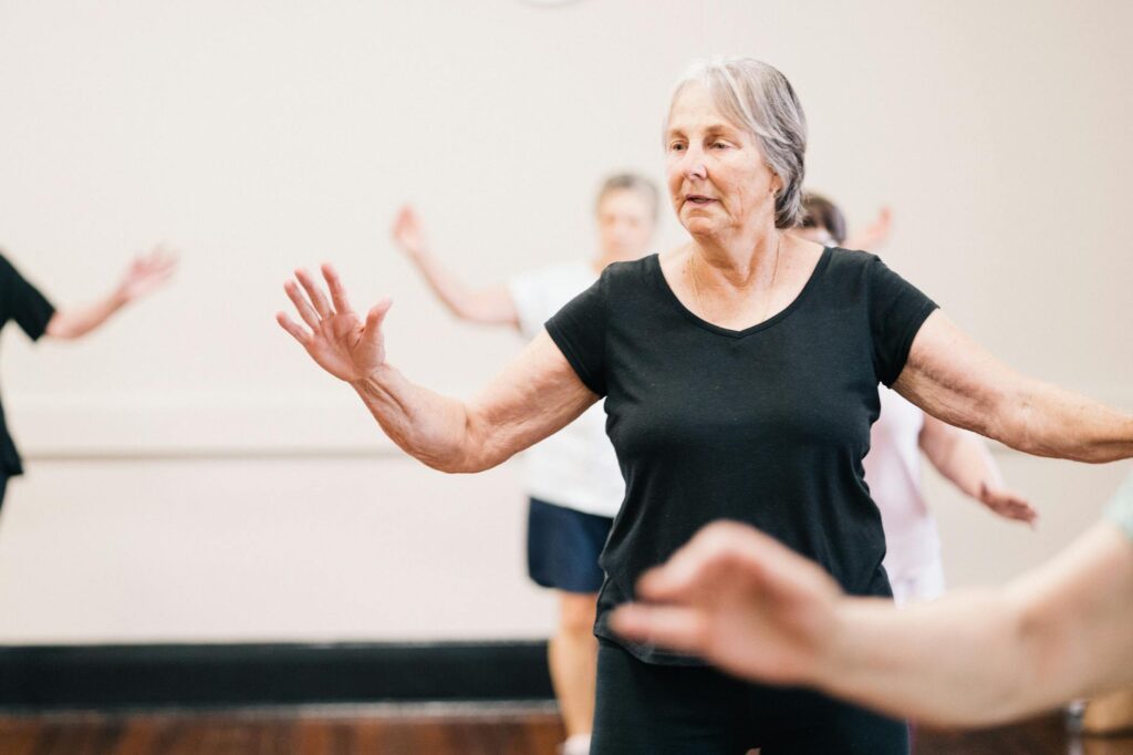 Elderly_women_enjoying_a_fitness_group_exercise_session_indoors..Wellness_Gallery_Catalyst_Foundation