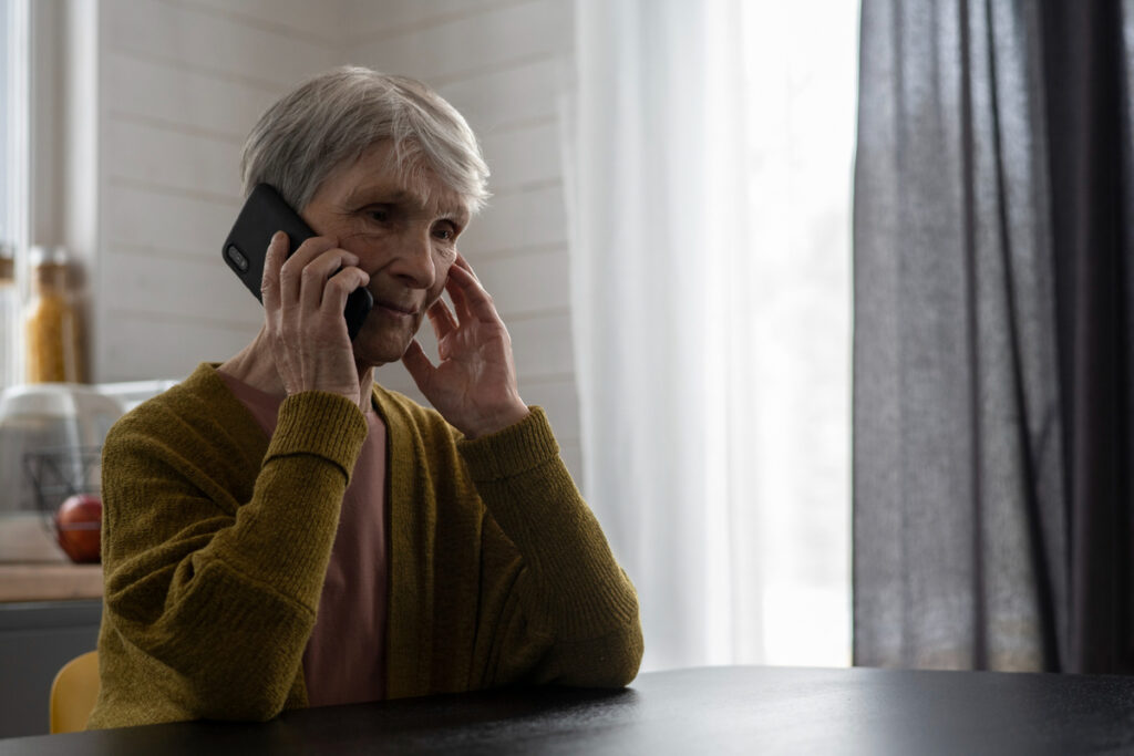 Medium shot senior woman talking on phone