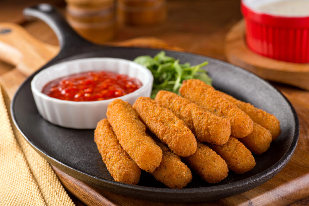Delicious breaded mozzarella cheese sticks with marinara dipping sauce.