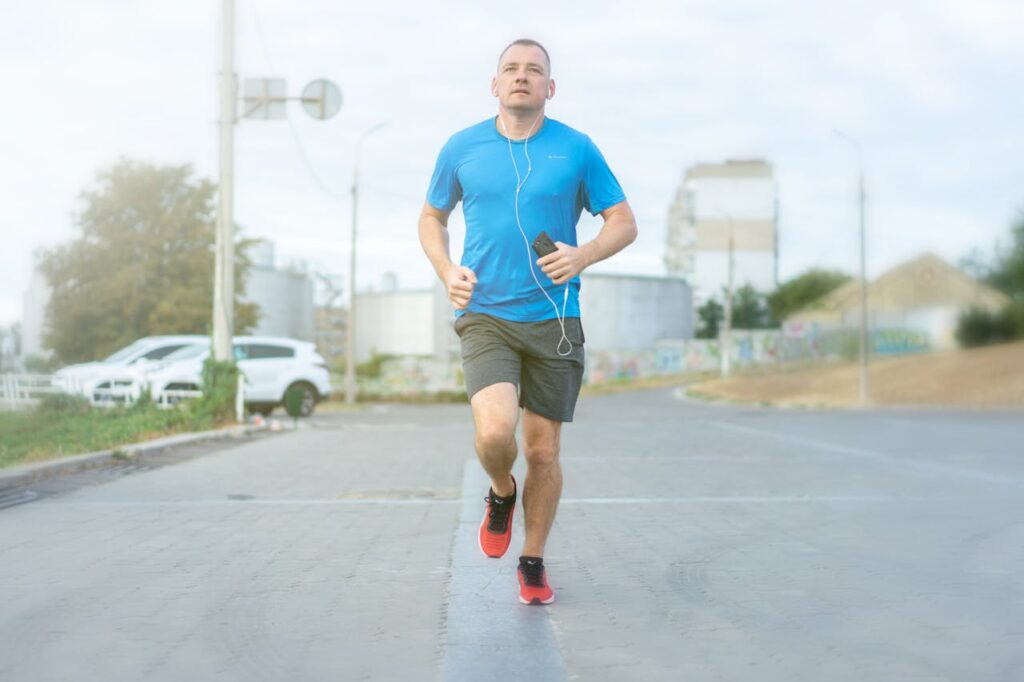 A Man Listening to Music While Running