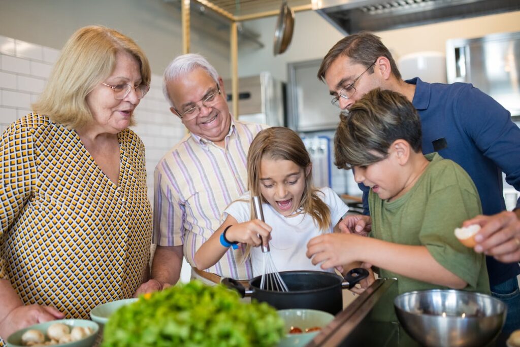 Grandparents Cooking in the Kitchen with Their Children