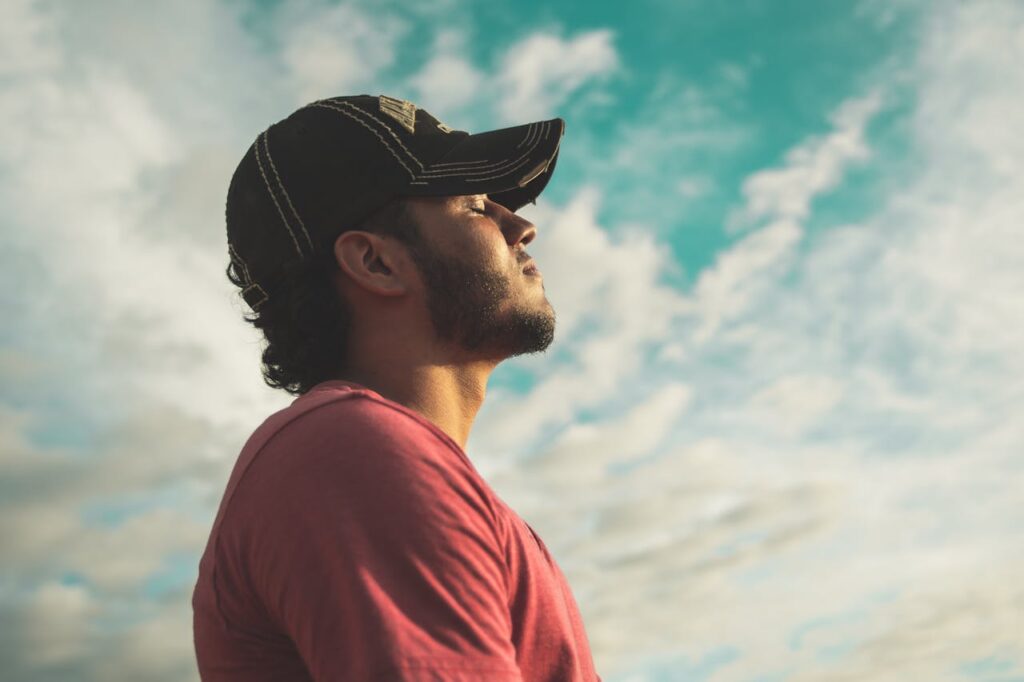 a guy taking breath in open sky