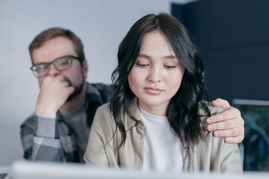 A Man Holding a Woman on her Shoulder