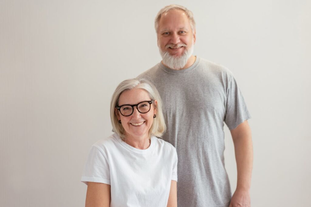 A Happy Elderly Couple Looking at Camera