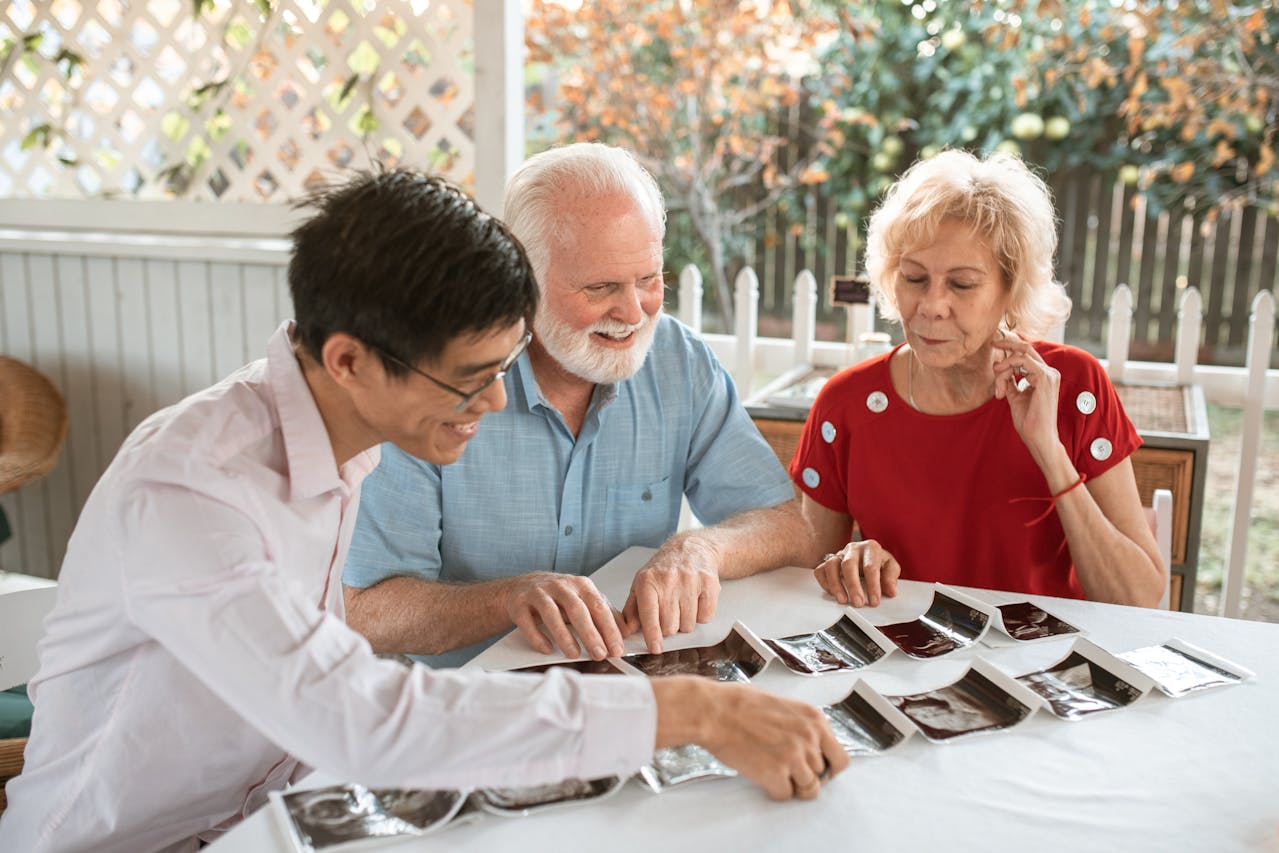 A Family Looking at the Sonogram on the Table