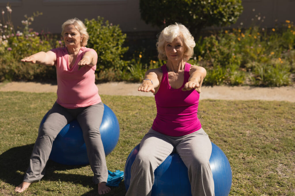 Senior women exercising on a exercise ball