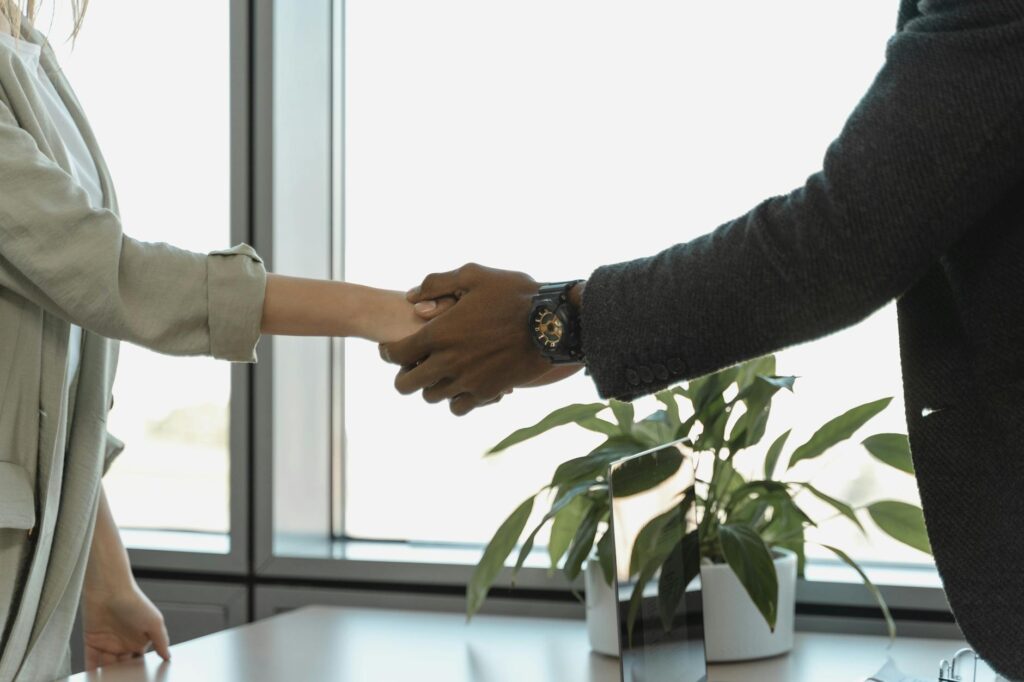 Professional_handshake_between_two_colleagues_in_modern_office..Tima_Miroshnichenko