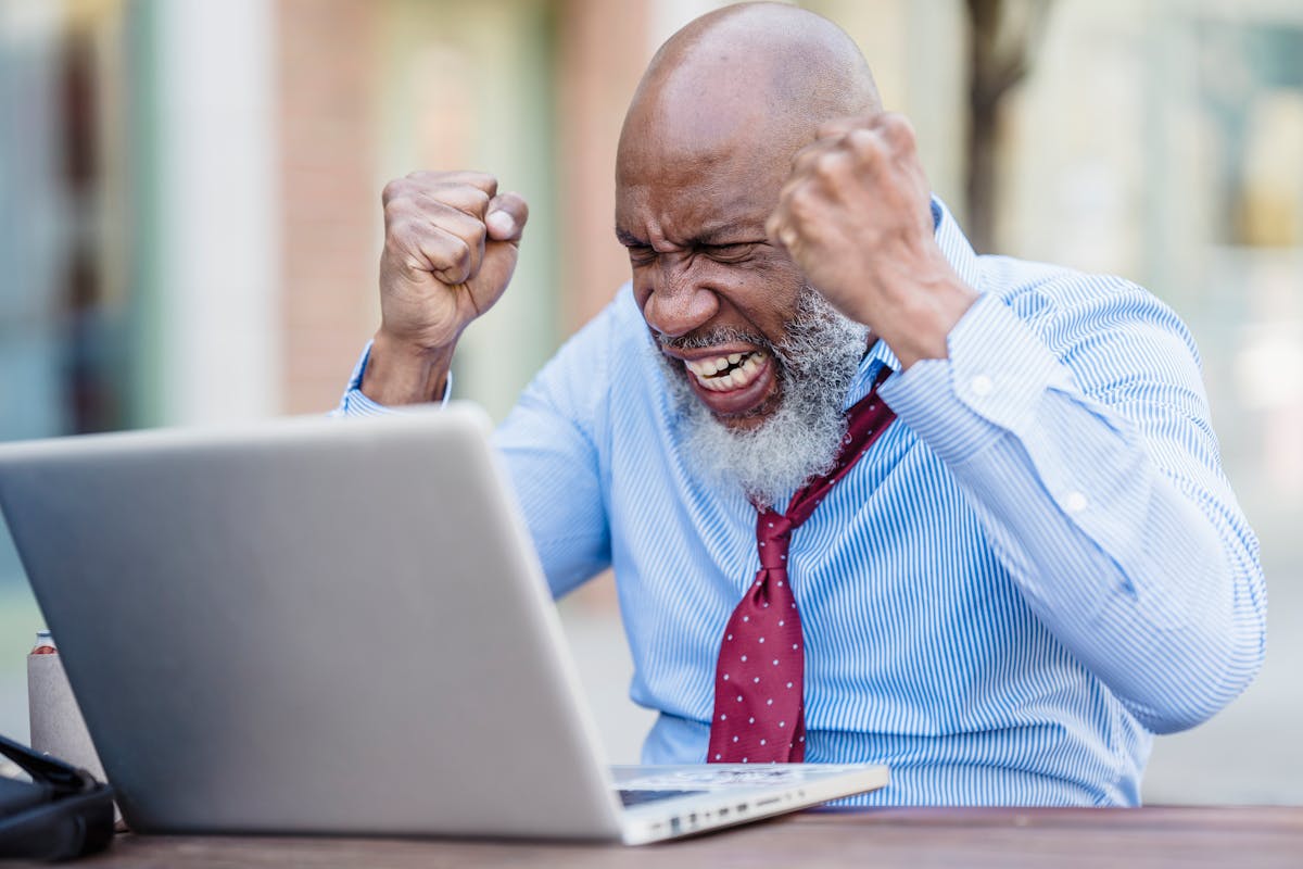 Frustrated Man in Front of a Laptop