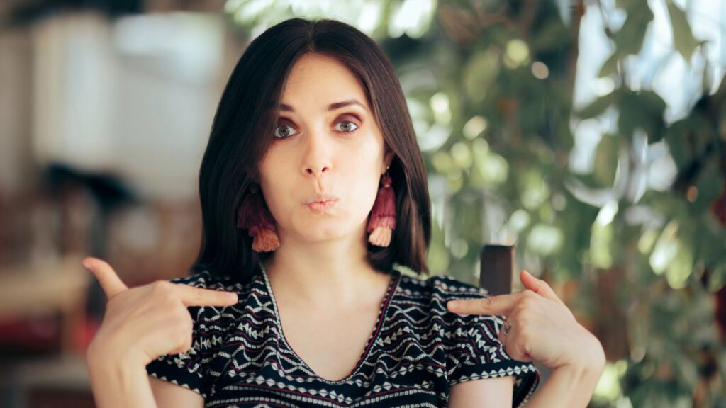 selfish woman pointing at self
