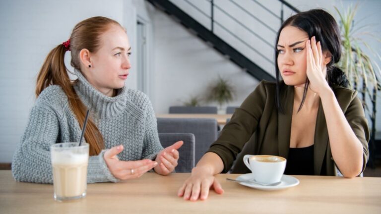 upset friends talking at table