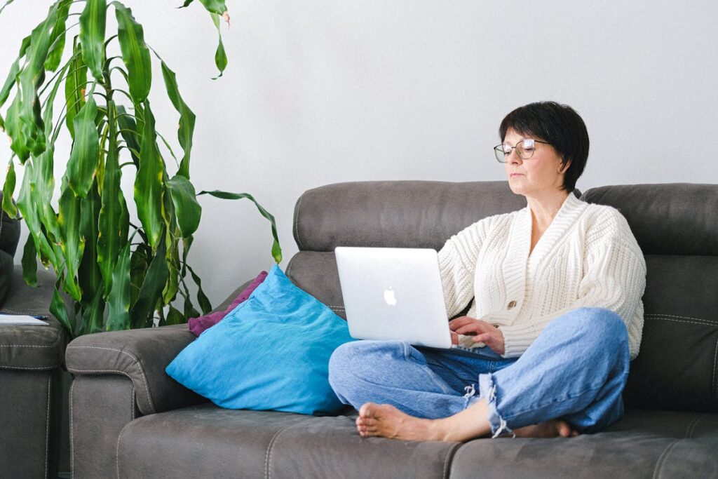 Close-Up Shot of a Woman Sitting on Couch