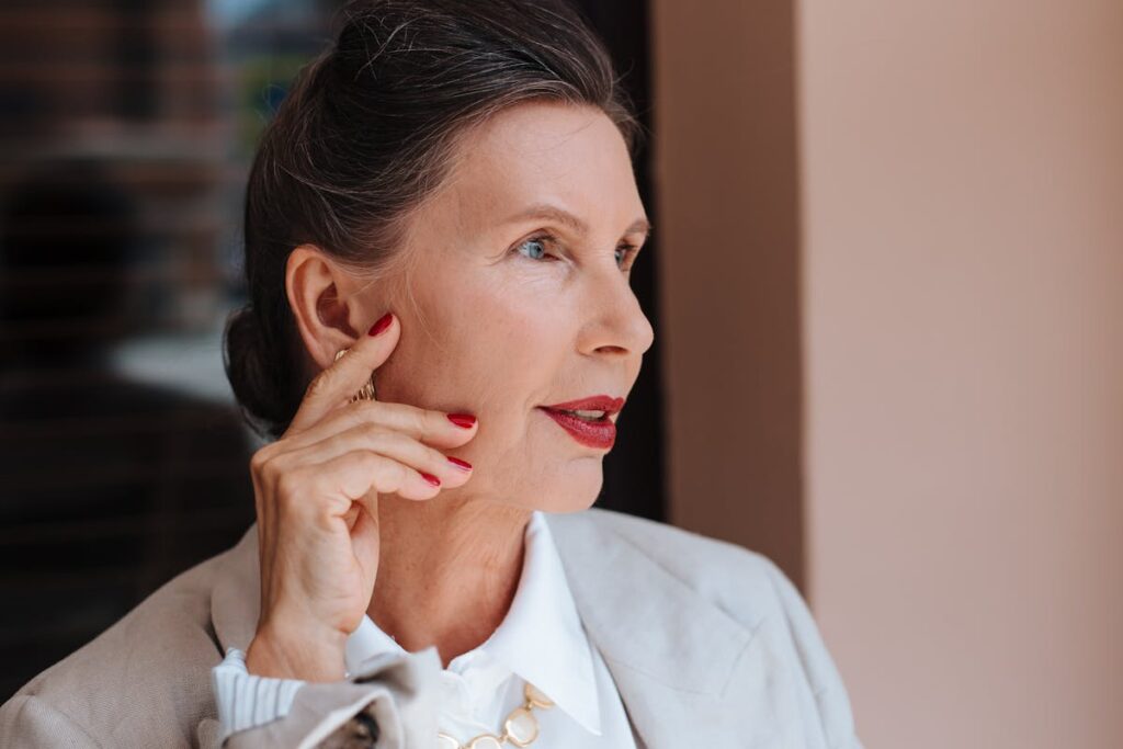 A Woman with Red Lips and Manicured Nails