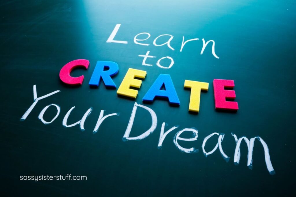 a sign that says "Learn to CREATE Your Dream."