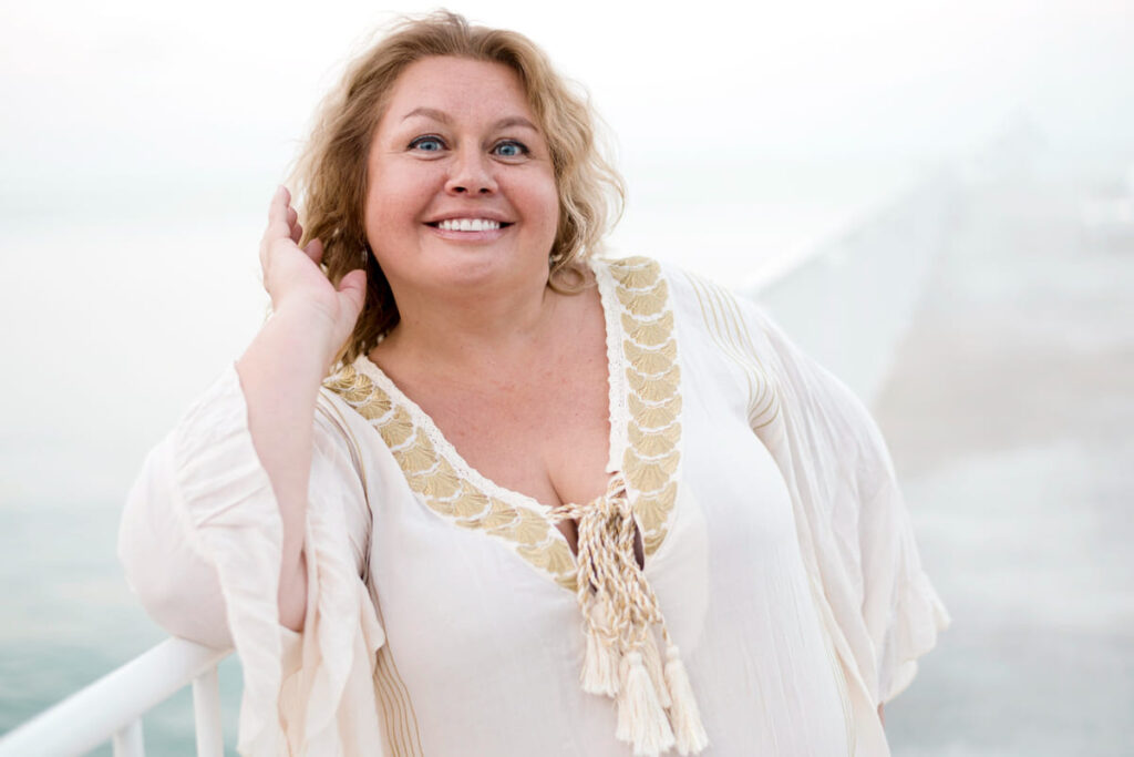 Plus size model smiling at the camera