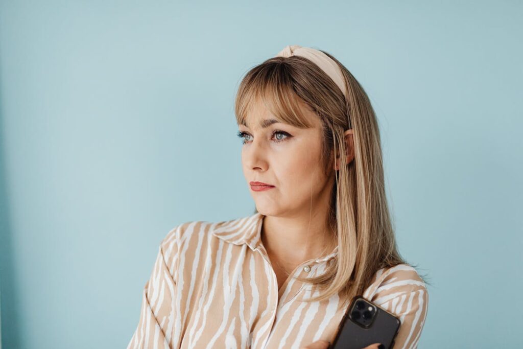 Woman in Striped Shirt with Headband Looking Afar