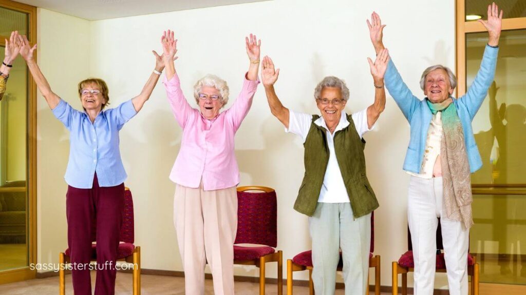 four older women doing stretches together for a healthy lifestyle.