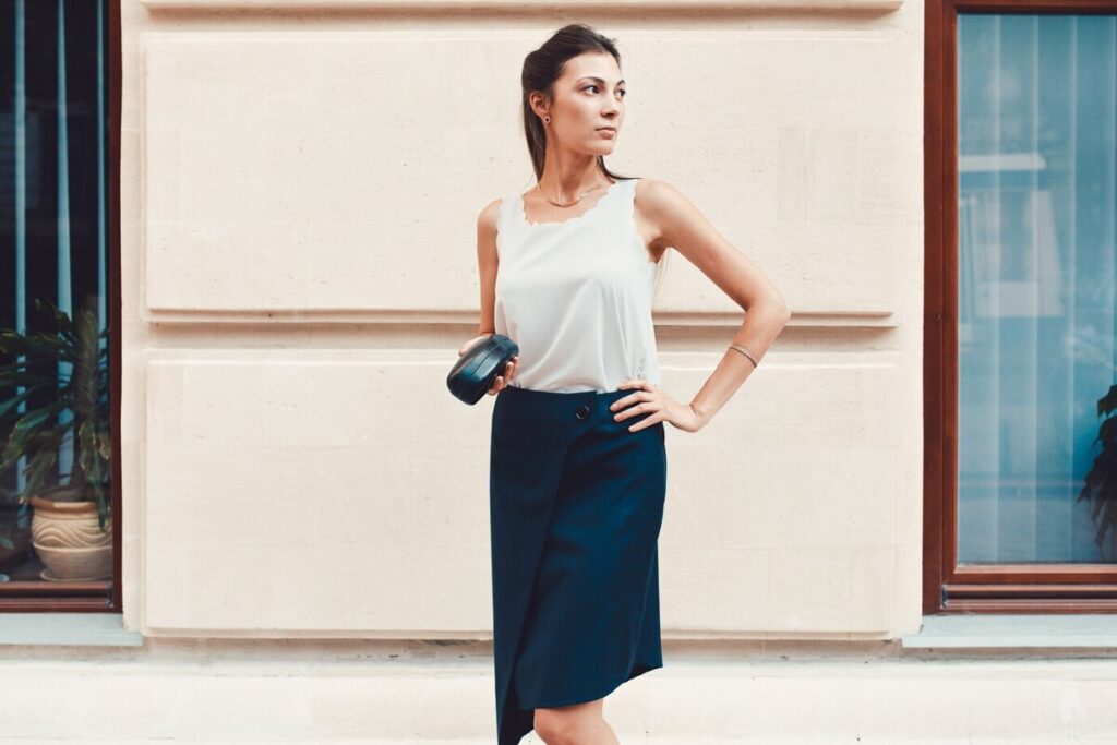Fashion pretty woman walking through the streets of Old City
