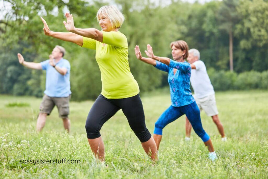 older people practicing stretches outside on a beautiful day.