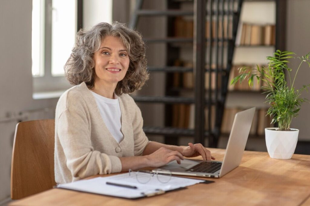 Portrait woman with laptop working